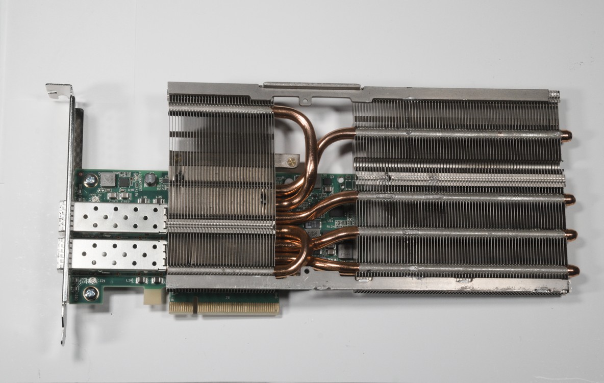 The card with the new heatsink attached. The heatsink sticks out beyond both the top and left edges of the card.