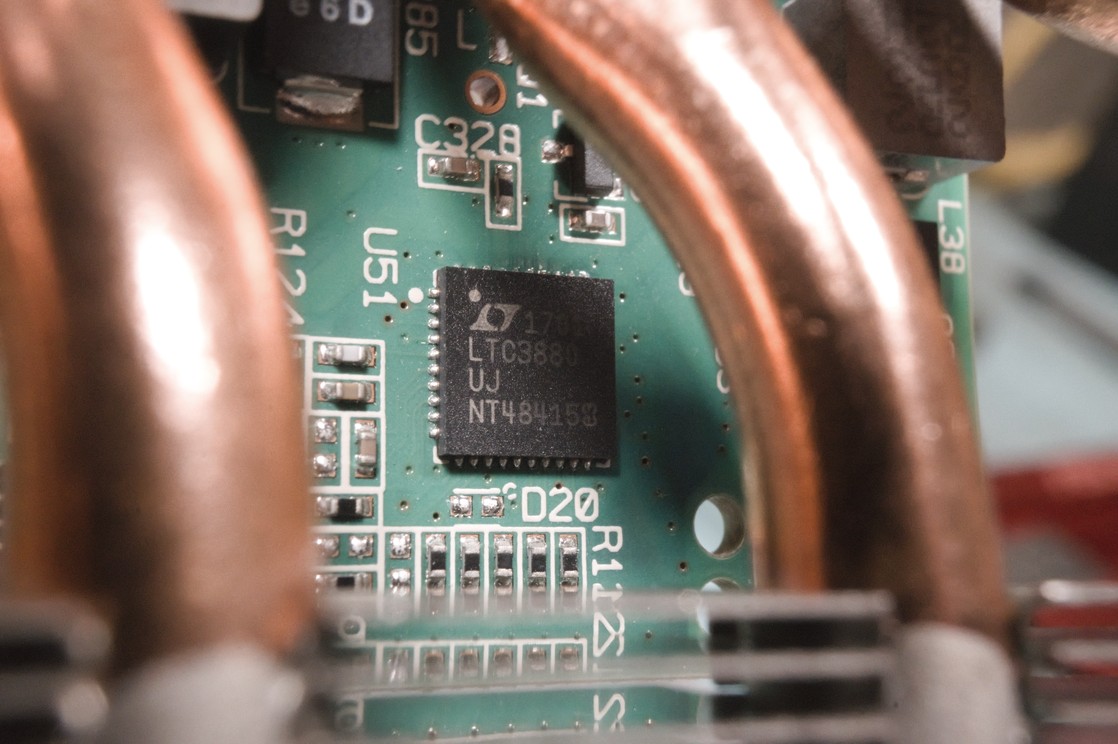 A close-up of a small surface-mount chip on the card. The text 'LTC3880' is visible on it.