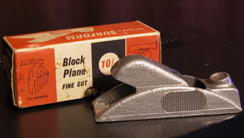 Box for a block plane with the text "for asbestos" on the side.